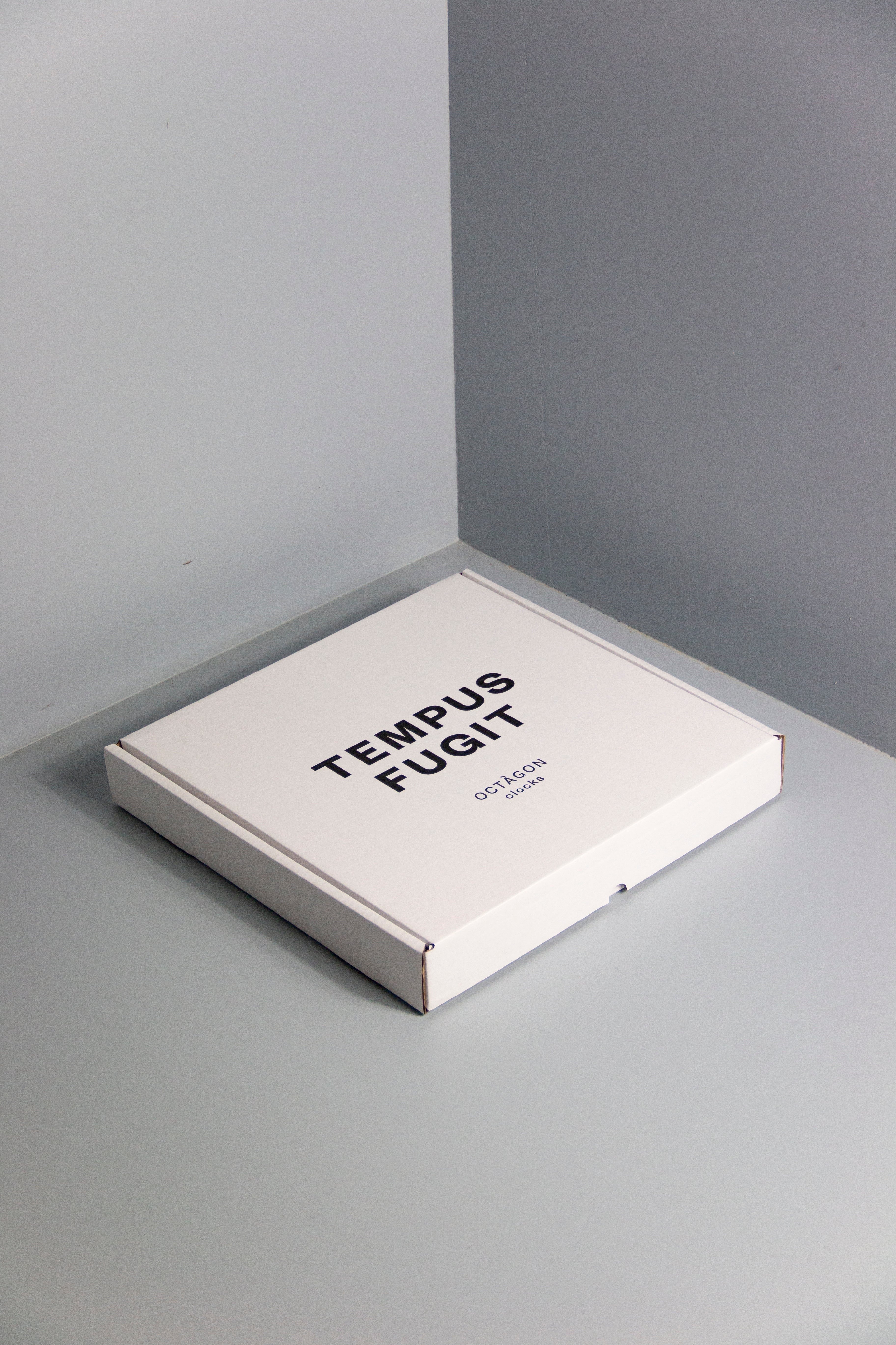 White clock box with &quot;Tempus fugit&quot; print black colour.