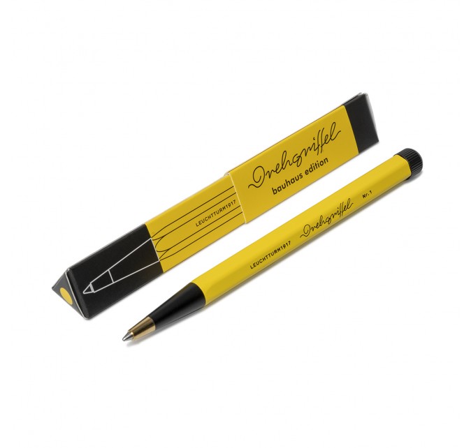 OCTÀGON DESIGN, Drehgriffel Pen , yellow and black color, white typography. The yellow and black color cardboard box of the pen.
