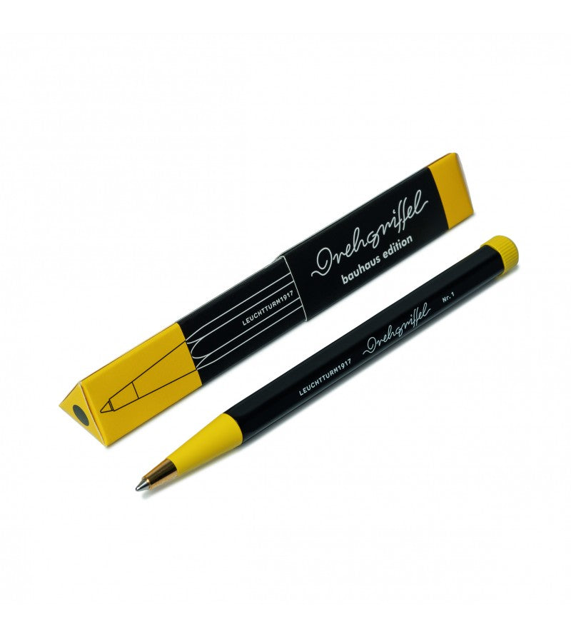 OCTÀGON DESIGN, Drehgriffel Pen , black and yellow color, white typography. The black and yellow color cardboard box of the pen.