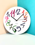 "Pepa" clock on a colored wall | Reloj "Pepa" en una pared de colores. | Rellotge "Pepa" en una paret de colors.