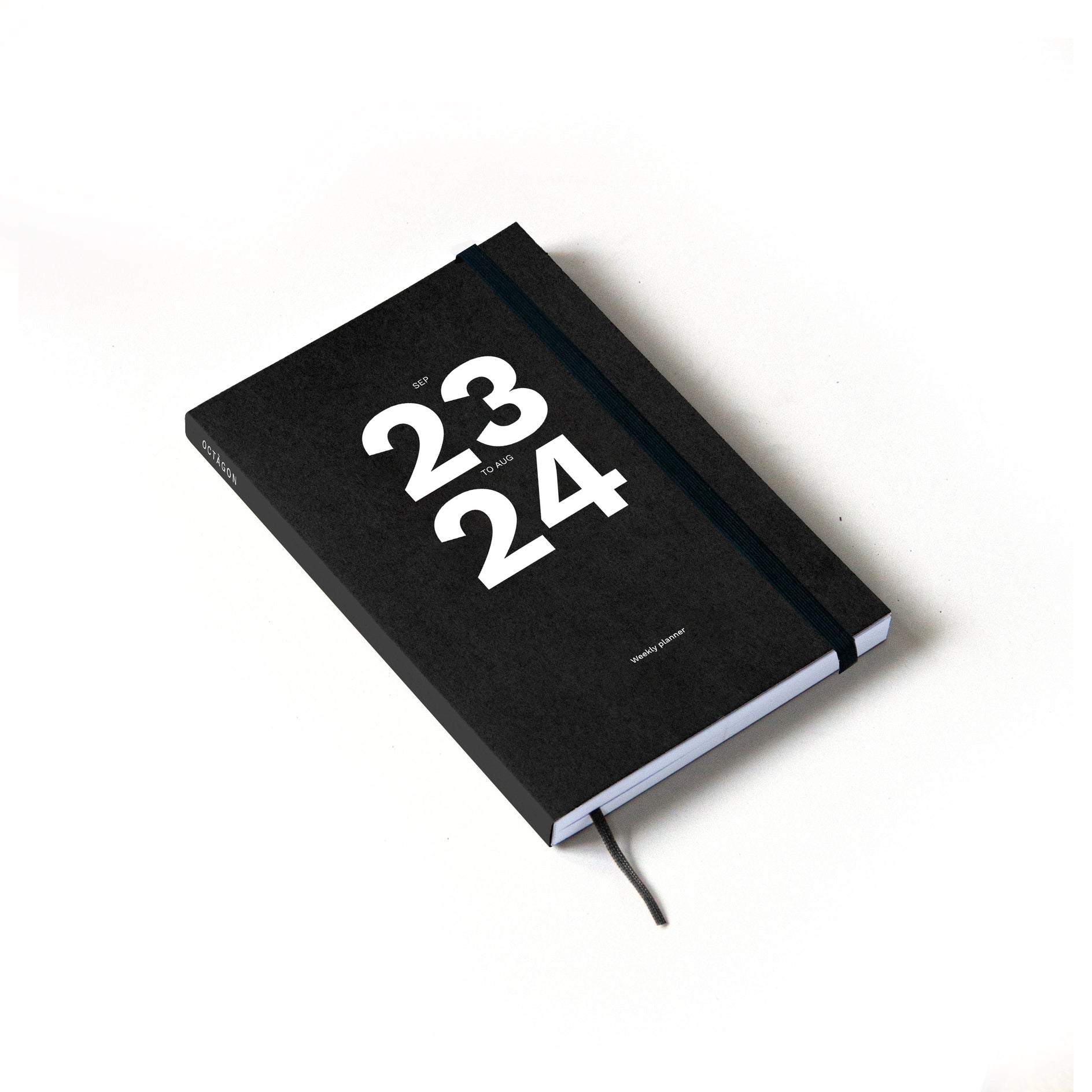 OCTÀGON DESIGN | Sep23 to Aug24 Academic weekly planner, black color, white typography with an elastic closure band.