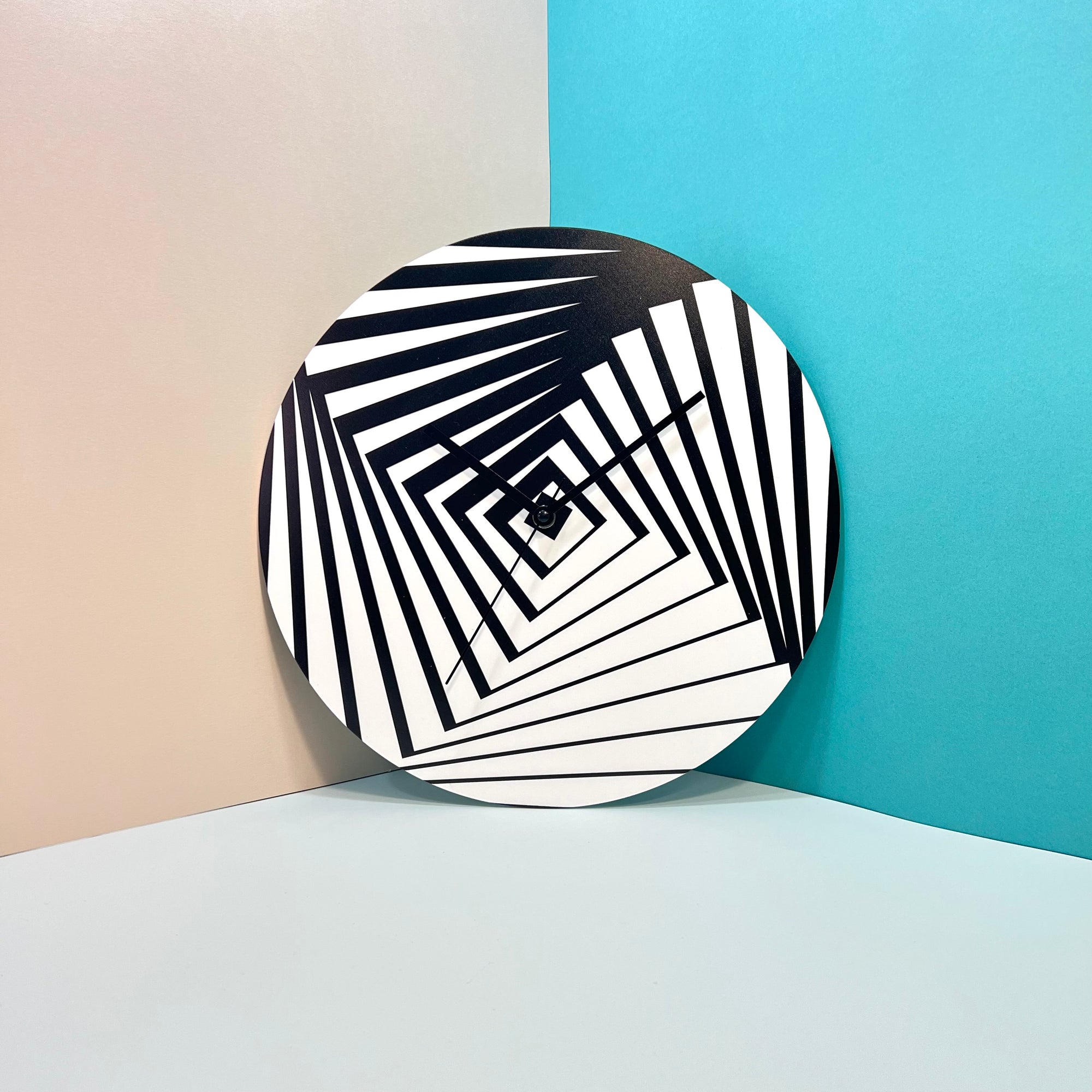 "Pop Art" wall clock. White and black base, clock hands black colour.