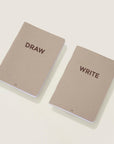 "Draw" and "Write" mini notebooks. Brown cover and brown typography.