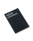 OCTÀGON DESIGN | "Adult content" thin notebook. Cover black color and white typography.