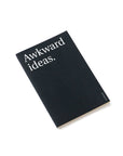 OCTÀGON DESIGN | "Awkward ideas" thin notebook. Cover black color and white typography.