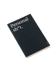 "Personal sh*t" thin notebook. Cover black color and white typography.