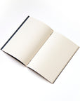 OCTÀGON DESIGN | Open "Adult content" dotted notebook. Binding with black thread.