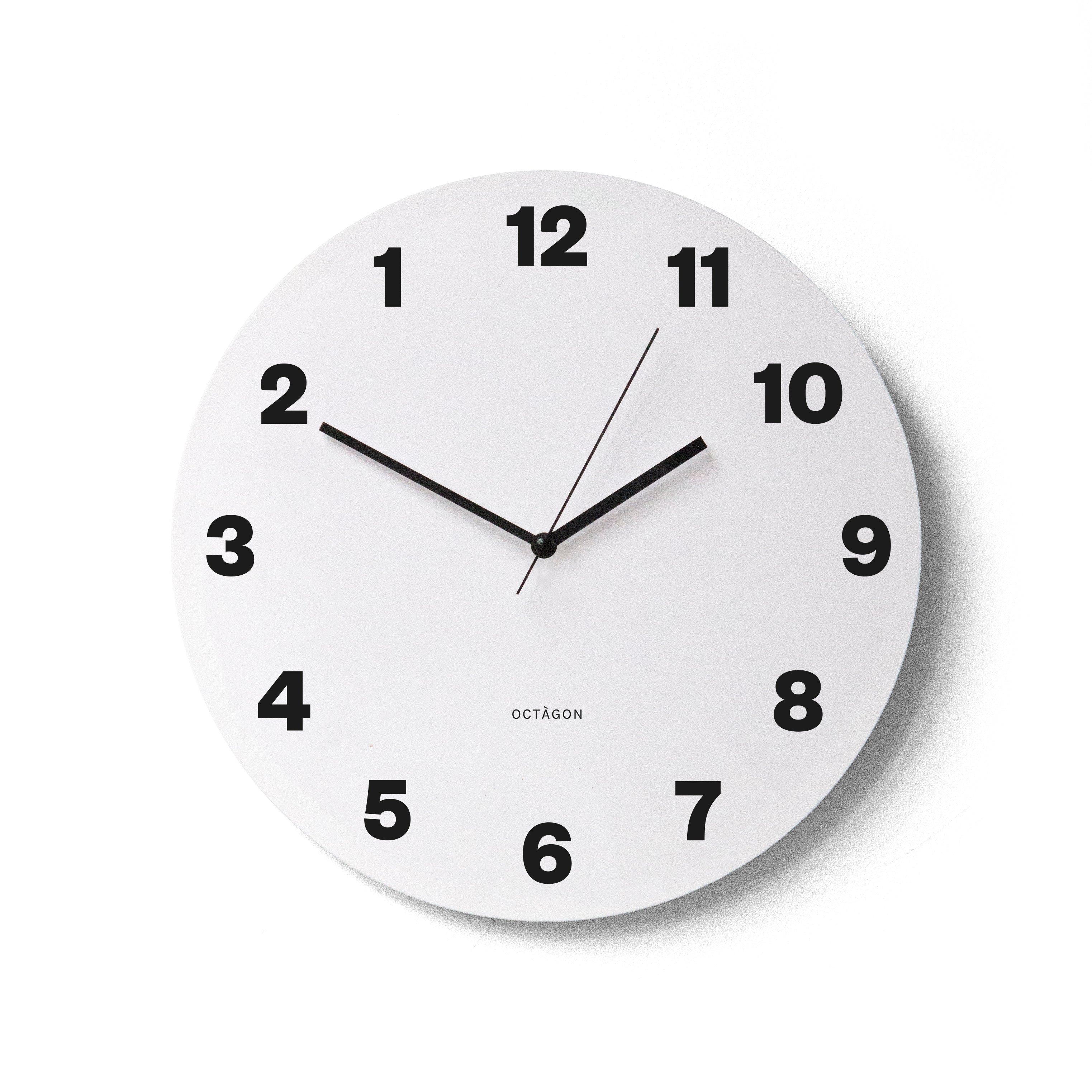 "Countdown" wall clock. White base, typography and clock hands black colour.